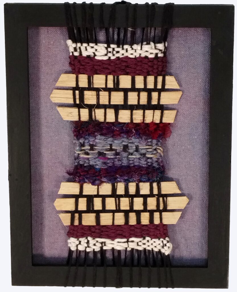 Ancient Voices, 2024, 5" X 7", multi-media textile weaving using repurposed sari silk, handspun yarn, and basket weaving material on a hand-dyed background 