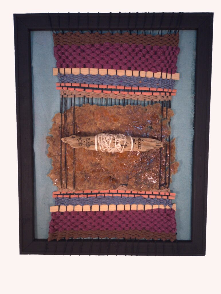 Ancient Ways, 2024, 13.5" X 17.5", multi-media textile with handwoven paper, basket weaving material, and a crocheted and wood-burned piece of driftwood. The driftwood was found on one of many trips to Lake Erie this year. The background is hand-dyed and reflects primitive figures that you might find in cave paintings. 